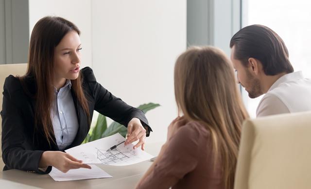 female agent presenting to couple